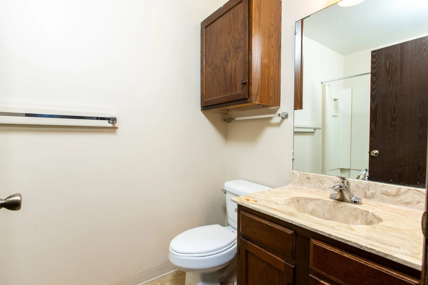 Original two bedroom bathroom with oak vanity and tub.