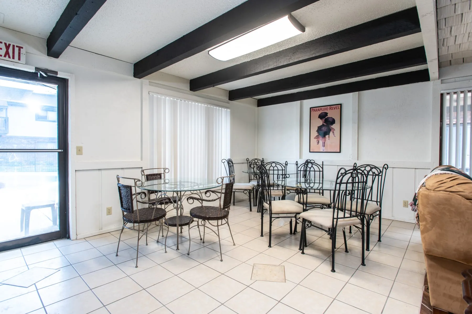 Clubhouse dining area with cafe tables and chairs.