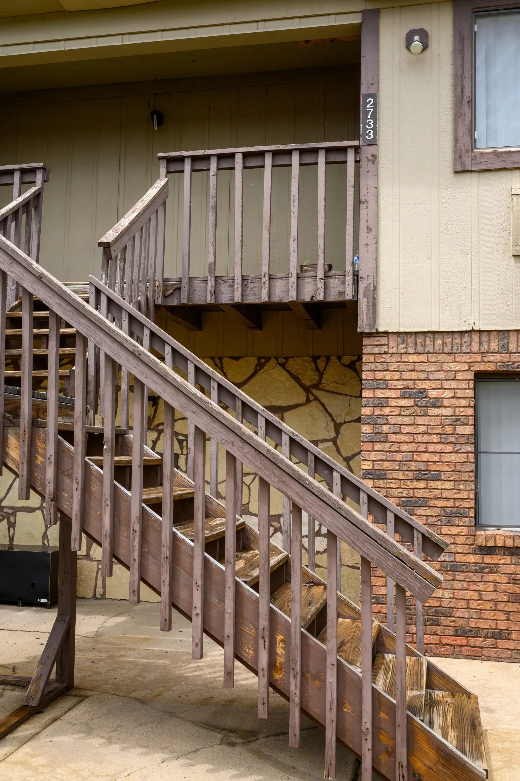 Exterior stair leading to the upper-floor apartments at Stoneybrook.